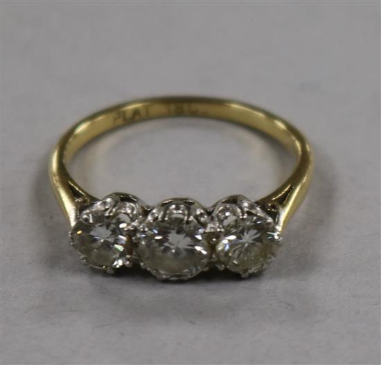 A three-stone diamond ring, the brilliants approx 1.45ct, platinum set on 18ct yellow gold shank